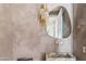 Modern bathroom features decorative paint on the walls, marble sink, modern faucet, and stylish light fixture at 8206 E Del Camino Dr, Scottsdale, AZ 85258