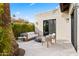 Inviting outdoor patio featuring comfortable seating around a modern fire pit and stylish decor at 8206 E Del Camino Dr, Scottsdale, AZ 85258