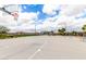 Well-maintained basketball court with hoops, seating, and lighting in the community at 8740 W San Miguel Ave, Glendale, AZ 85305