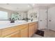 Bright bathroom with dual sinks, vanity, and well-lit mirrors at 8740 W San Miguel Ave, Glendale, AZ 85305