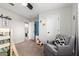 This bedroom includes a gray chair and a view into the en-suite bathroom at 8740 W San Miguel Ave, Glendale, AZ 85305