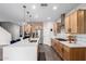 Bright kitchen featuring an island with seating, stainless steel appliances, and plenty of cabinet space at 8740 W San Miguel Ave, Glendale, AZ 85305