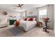 Bright and inviting main bedroom with plush carpet, exercise equipment, and natural light at 8740 W San Miguel Ave, Glendale, AZ 85305