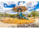 Community playground with a blue slide, shade cover, climbing structure, swings and bench seating for parents at 8740 W San Miguel Ave, Glendale, AZ 85305