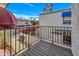 Balcony with dark wood flooring and a railing with colorful flowers and neighborhood views at 8840 S 51St St # 2, Phoenix, AZ 85044