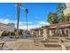 Community pool with tall palm trees, seating area and lounge chairs perfect for relaxing and enjoying sunny days at 8840 S 51St St # 2, Phoenix, AZ 85044