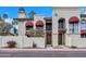 Charming two-story condo with red awnings, a well-maintained yard and balcony at 8840 S 51St St # 2, Phoenix, AZ 85044