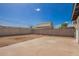 Backyard showcasing a patio area with a shed, surrounded by a block fence at 9127 E Broadway Rd, Mesa, AZ 85208