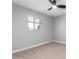 Bedroom featuring light blue brick walls, ceiling fan, carpeted floor and a window with blinds at 9127 E Broadway Rd, Mesa, AZ 85208