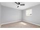 Bedroom featuring light blue brick walls, ceiling fan, carpeted floor and a window with blinds at 9127 E Broadway Rd, Mesa, AZ 85208