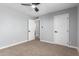 Bedroom featuring carpeted floor and an open door leading to another room at 9127 E Broadway Rd, Mesa, AZ 85208