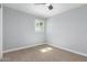 Bedroom featuring light blue brick walls, ceiling fan, carpeted floor and a window with blinds at 9127 E Broadway Rd, Mesa, AZ 85208