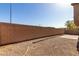 Spacious backyard with block wall and desert landscaping offers privacy at 9643 N 81St Dr, Peoria, AZ 85345