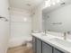 Bathroom featuring a shower-tub combo, toilet, and double sink vanity at 9643 N 81St Dr, Peoria, AZ 85345