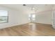 Light-filled bedroom with wood-look flooring and large windows offering plenty of natural light at 9643 N 81St Dr, Peoria, AZ 85345