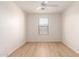 Well-lit bedroom showcasing wood-look flooring and a window creating an airy atmosphere at 9643 N 81St Dr, Peoria, AZ 85345