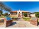 Historical community building with a red tile roof, white trim, and manicured grounds at 9643 N 81St Dr, Peoria, AZ 85345