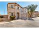 Two-story home exterior featuring shutters, desert landscaping, and attached two-car garage at 9643 N 81St Dr, Peoria, AZ 85345