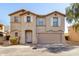 Charming two-story home featuring a two-car garage and desert landscaping at 9643 N 81St Dr, Peoria, AZ 85345