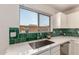 Close up of the kitchen sink area showing the garden view from the window at 9643 N 81St Dr, Peoria, AZ 85345