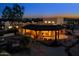 A beautiful desert home featuring an outdoor patio and fire pit set against a mountain backdrop at 10303 E Hummingbird Ln, Gold Canyon, AZ 85118