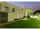 Backyard featuring lush artificial grass and privacy at dusk at 10534 N 133Rd St, Scottsdale, AZ 85259