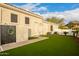 Well-maintained backyard with lush artificial grass and privacy at 10534 N 133Rd St, Scottsdale, AZ 85259