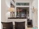 Convenient bar area with sleek countertops, seating, and a mini-fridge, perfect for entertaining at 10534 N 133Rd St, Scottsdale, AZ 85259
