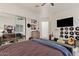 Cozy bedroom with a mirrored closet, stylish decor, and a comfortable bed, perfect for relaxation at 10534 N 133Rd St, Scottsdale, AZ 85259