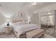 Bright bedroom with a comfortable bed, stylish lamps, and a mirrored closet, offering a relaxing space at 10534 N 133Rd St, Scottsdale, AZ 85259