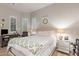 Serene bedroom featuring neutral tones, plantation shutters, and a comfortable bed, creating a restful environment at 10534 N 133Rd St, Scottsdale, AZ 85259