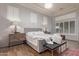 Bright bedroom with a tray ceiling, plantation shutters, and neutral tones at 10534 N 133Rd St, Scottsdale, AZ 85259