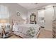 Cozy bedroom featuring a comfortable bed, stylish decor, and a view into an ensuite bathroom at 10534 N 133Rd St, Scottsdale, AZ 85259