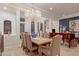 Formal dining area with a chandelier, a wooden table, and stylish chairs at 10534 N 133Rd St, Scottsdale, AZ 85259