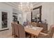 Elegant dining room featuring a large table, chandelier, and sophisticated decor at 10534 N 133Rd St, Scottsdale, AZ 85259