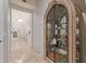 Hallway featuring a unique display case and views into other rooms, creating an inviting and spacious atmosphere at 10534 N 133Rd St, Scottsdale, AZ 85259
