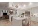 Open kitchen featuring stainless steel appliances, large island with seating, and an attached living room at 10534 N 133Rd St, Scottsdale, AZ 85259