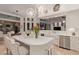 Bright kitchen featuring an island with seating, modern appliances, and a seamless flow to the dining area at 10534 N 133Rd St, Scottsdale, AZ 85259