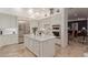 Bright, white kitchen with stainless steel appliances and a large island, great for entertaining at 10534 N 133Rd St, Scottsdale, AZ 85259