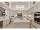 Bright modern kitchen featuring a large island, stainless steel appliances, and ample cabinet space at 10534 N 133Rd St, Scottsdale, AZ 85259
