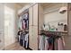 Spacious walk-in closet featuring built-in shelving and rods for ample storage space at 10534 N 133Rd St, Scottsdale, AZ 85259