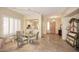 Inviting dining area with travertine floors, open to the kitchen and entry at 10572 E Tierra Buena Ln, Scottsdale, AZ 85255