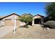 Attractive single-story home with a desert-style landscape, a two car garage, and an inviting entrance at 10572 E Tierra Buena Ln, Scottsdale, AZ 85255