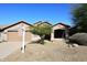 Charming single-Gathering home with desert landscaping, a two-car garage, and a welcoming front porch at 10572 E Tierra Buena Ln, Scottsdale, AZ 85255