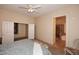 Spacious main bedroom featuring a walk-in closet and an en-suite bathroom with tile flooring at 10572 E Tierra Buena Ln, Scottsdale, AZ 85255