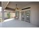 Covered patio area with ceiling fan and access to the backyard at 10572 E Tierra Buena Ln, Scottsdale, AZ 85255