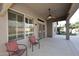 Inviting covered patio area with a ceiling fan and views of the landscape at 10572 E Tierra Buena Ln, Scottsdale, AZ 85255