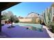 Sparkling pool surrounded by lush landscaping, including mature saguaro cactus at 10572 E Tierra Buena Ln, Scottsdale, AZ 85255