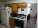 View of the kitchen featuring a refrigerator and oven at 10607 W El Rancho Dr, Sun City, AZ 85351