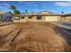 Charming single-story home with xeriscaped front yard, attached garage, and blue sky at 11020 N 45Th Ave, Glendale, AZ 85304
